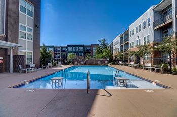 Resort-style swimming pool with tanning ledge